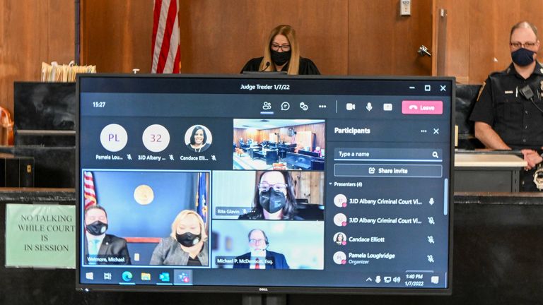 Judge Holly Trexler looks on as Former New York Gov. Andrew Cuomo appears virtually for a court session in Albany City Court, as she considers a prosecutor&#39;s request to dismiss a fondling case against him in Albany, N.Y. U.S., Friday, Jan. 7, 2022, Hans Pennink/Pool via REUTERS
