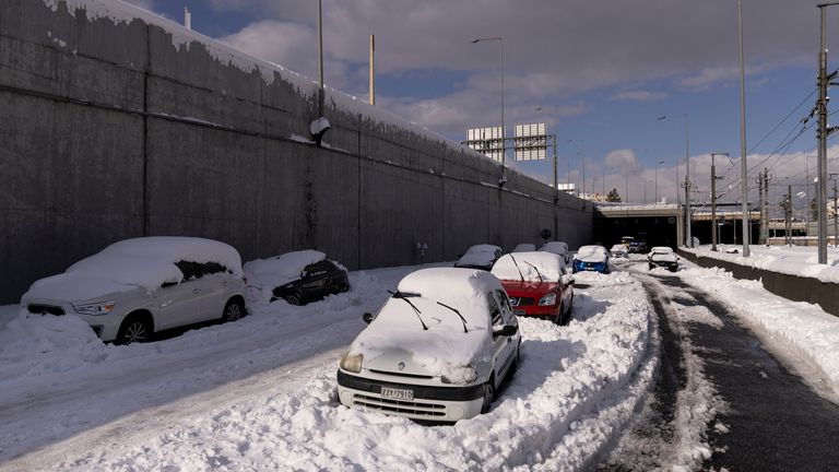 Abandoned vehicles are covered in snow in the Attiki Odos motorway, following heavy snowfall in Athens, Greece, January 25, 2022. REUTERS/Alkis Konstantinidis
