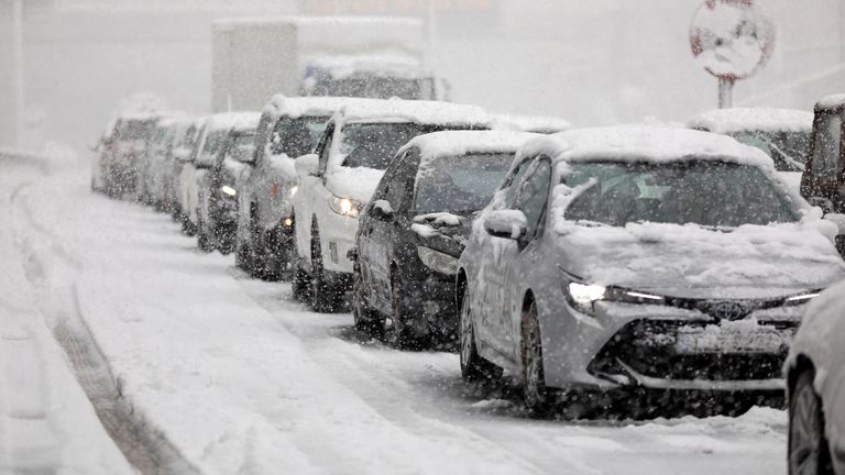 Vehicles are stuck in traffic in the Attiki Odos motorway, during heavy snowfall in Athens, Greece, January 24, 2022. REUTERS/Stelios Misinas
