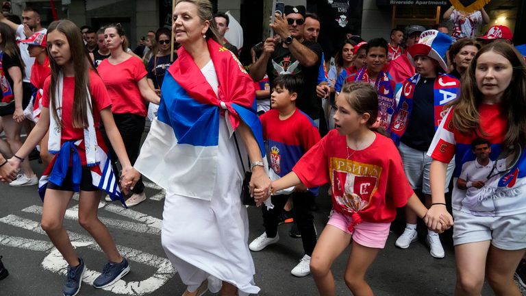 Fans dance and sing outside an immigration detention hotel where Serbian Novak Djokovic is confined in Melbourne, Australia,
PIC:AP