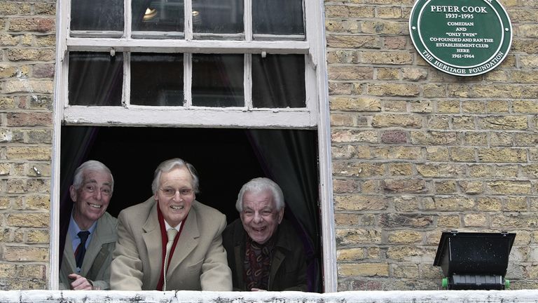 Comedian Barry Cryer (right), television presenter Nicholas Parsons (centre) and comedian Jo Goodman (left) at the window of the site in Greek Street, Soho where Peter Cook&#39;s Establishment Club was today commemorated with the unveiling of a Westminster green plaque, in central London.