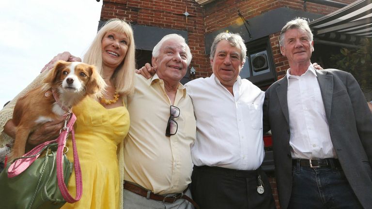 FILE PHOTO: Monty Python&#39;s Flying Circus actors (L-R) Carol Cleveland, former colleague Barry Cryer, actor Terry Jones and Michael Palin pose outside the Angel pub in Highgate, north London September 6, 2012. A blue plaque organised by friends and family was unveiled to former Monty Python star Graham Chapman following news that English Heritage had dropped plans for an &#39;official&#39; Blue Plaque to the star, due to budget cuts. Chapman drank, wrote and was barred from the Angel pub in the 1970s. RE