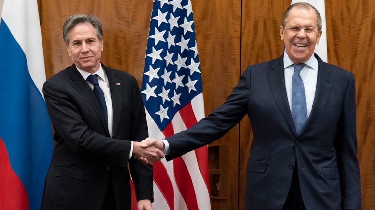 US Secretary of State Antony Blinken, left, shakes hands with Russian Foreign Minister Sergey Lavrov before their meeting, Friday, Jan. 21, 2022, in Geneva, Switzerland. (AP Photo/Alex Brandon, Pool)