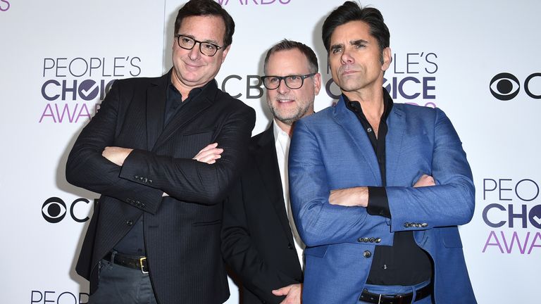 FILE - Bob Saget, from left, Dave Coulier and John Stamos, winners of the award for favorite premium comedy series for "Fuller House," pose in the press room at the People&#39;s Choice Awards at the Microsoft Theater on Wednesday, Jan. 18, 2017, in Los Angeles. Saget, a comedian and actor known for his role as a widower raising a trio of daughters in the sitcom “Full House,” has died, according to authorities in Florida, Sunday, Jan. 9, 2022. He was 65. (Photo by Jordan Strauss/Invision/AP, File)


