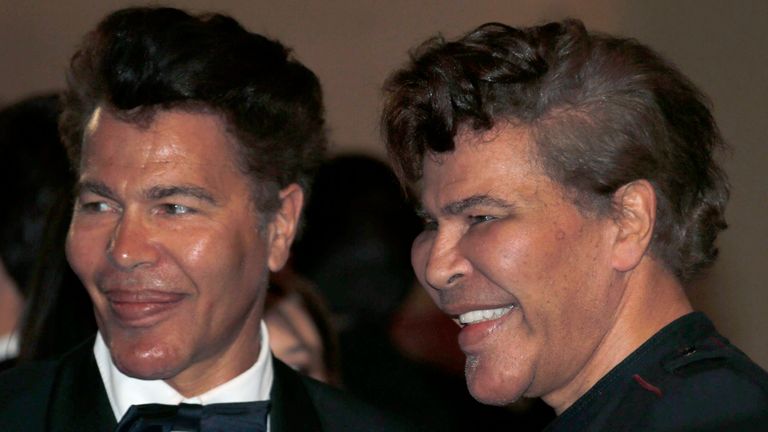 Grichka Bogdanoff (L) and Igor Bogdanoff, seen at the Cannes Film Festival in 2013, became famous for their shared love of plastic surgery
