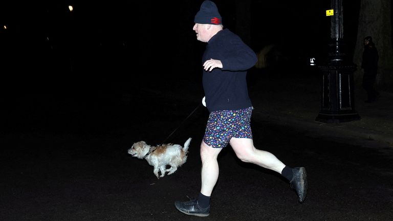 Boris Johnson is pictured on a run with his dog, Dilyn,