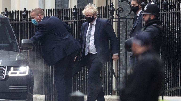 British Prime Minister Boris Johnson walks outside Downing Street in London, Britain, January 25, 2022. REUTERS/Hannah McKay
