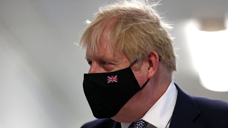 Prime Minister Boris Johnson wears a face mask during a visit to Milton Keynes University Hospital in Buckinghamshire. Picture date: Monday January 24, 2022.
