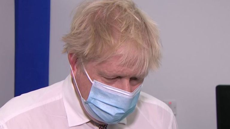 Boris Johnson looks down when asked about parties in Downing Street the night before the Duke of Edinburgh's funeral