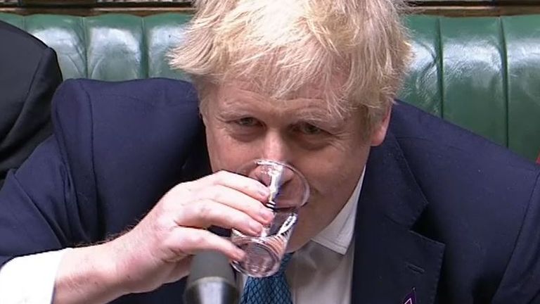 Boris Johnson talks a drink of water during PMQs