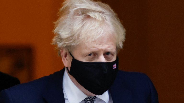 British Prime Minister Boris Johnson walks outside Downing Street in London, Britain, January 25, 2022. REUTERS/Peter Cziborra
