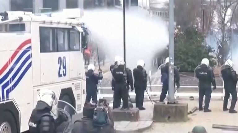 Riot police in Brussels use water cannon on anti-COVID measures protesters