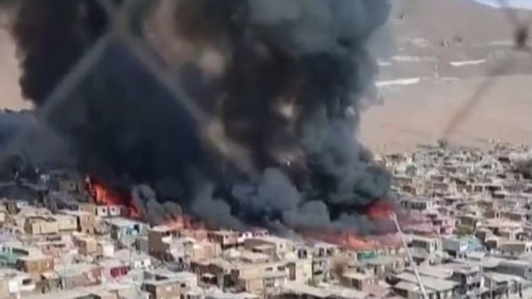 Fire rages through slum area in Chile