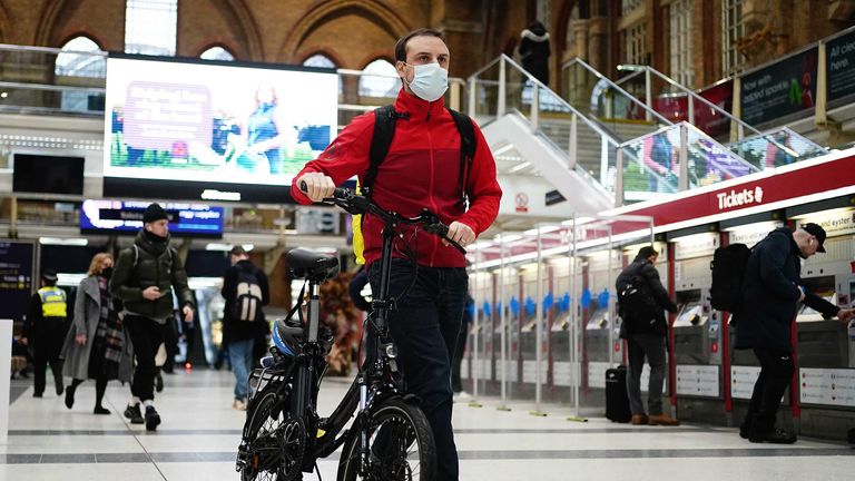 Commuters at Liverpool Street station, London, as Plan B measures are lifted in England. Face coverings will no longer be mandatory in any setting, and the NHS Covid Pass will no longer be compulsory for entry into nightclubs and other large venues. Picture date: Thursday January 27, 2022.