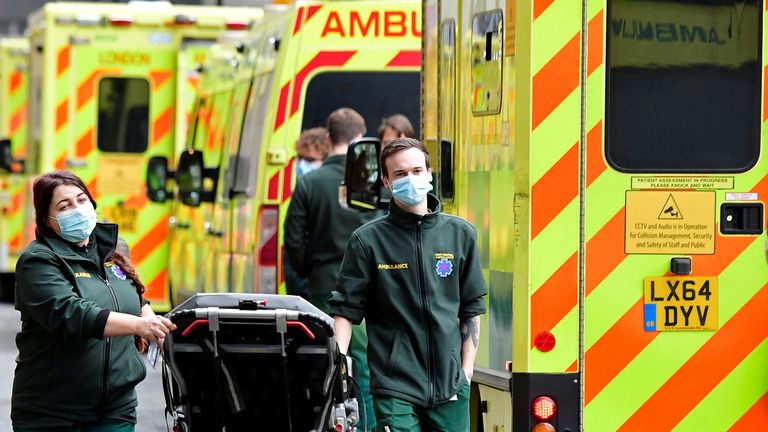 FILE PHOTO: Health workers move equipment between ambulances outside of the Royal London Hospital, amid the coronavirus disease (COVID-19) pandemic in London, Britain, January 7, 2022. REUTERS/Toby Melville/File Photo
