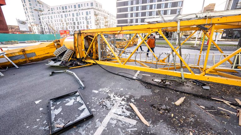 A construction crane was brought down in central Malmo, Sweden. Pic: AP
