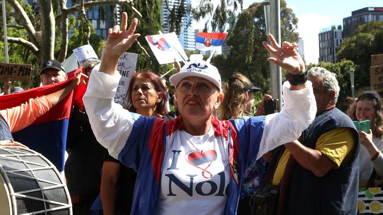A protester and fan of Serbia&#39;s Novak Djokovic outside the Park Hotel in Australia                                                                                                     