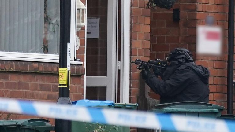 An armed police officer outside a property in Earlsdon Avenue North, Coventry, where police remain in a stand-off with a man. Officers from West Midlands Police were called to the property on Sunday to carry out a welfare check on a man and child, who are both believed to still be inside the property. Picture date: Monday January 10, 2022.