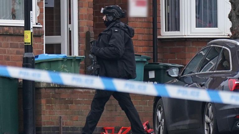 An armed police officer outside a property in Earlsdon Avenue North, Coventry, where police remain in a stand-off with a man. Officers from West Midlands Police were called to the property on Sunday to carry out a welfare check on a man and child, who are both believed to still be inside the property. Picture date: Monday January 10, 2022.