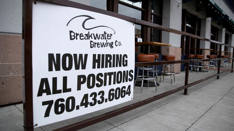 FILE PHOTO: A restaurant advertising jobs looks to attract workers in Oceanside, California, U.S., May 10, 2021