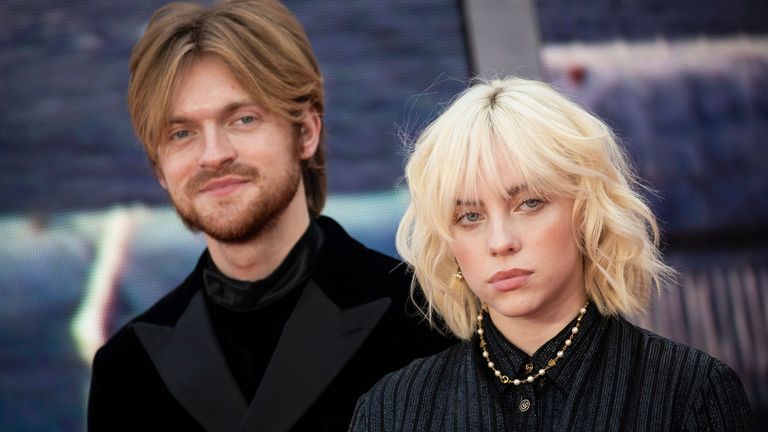 Finneas O'Connell and Billie Eilish pose for photographers as they arrive for the world premiere of the new film in the James Bond franchise 