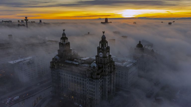 The Royal Liver Building surrounded by the early morning fog in Liverpool. Picture date: Tuesday December 14, 2021