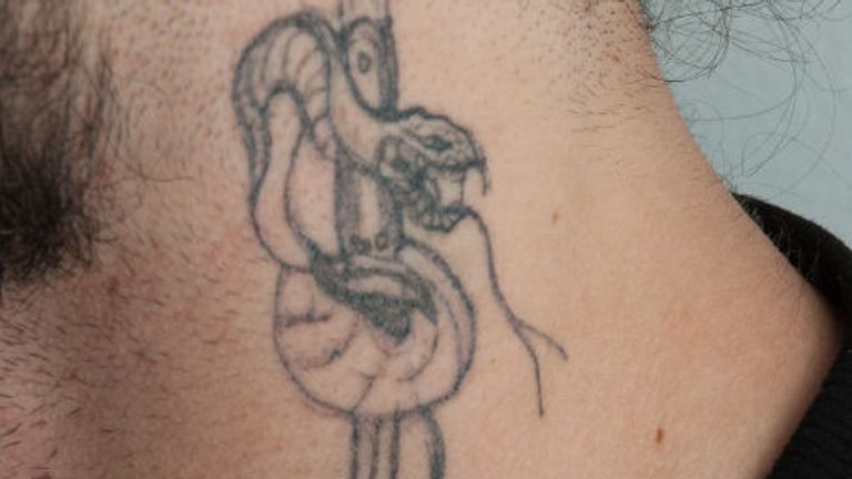 George Knights had a tattoo of snake wrapped around a knife, which was similar to the murder weapon. Pic: Kent Police