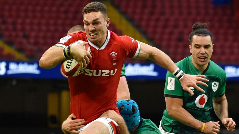 Wales&#39; George North runs on his way to score a try during a Six Nations game against Ireland in 2021