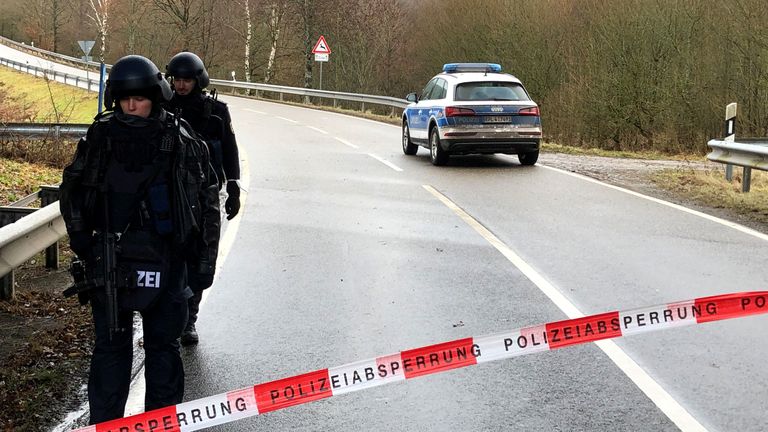 A police car blocks a road after two German police officers were fatally shot early January 31, 2022, during a routine traffic stop near Kusel, southwestern Germany. Police were searching for the suspects, who fled the scene, police in the state of Rhineland-Palatinate said in a statement. REUTERS/Thilo Schmuelgen
