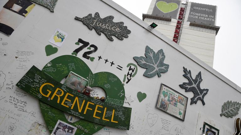Messages of condolence are seen on temporary hoardings and on the covered remains of the Grenfell Tower, after it was announced Britain&#39;s government will seek an extra 4 billion pounds ($5.4 billion) from property developers to fund repairs to dangerous apartment blocks, in the wake of a fire that killed more than 70 people at Grenfell in 2017, in London, Britain, January 10, 2022. REUTERS/Toby Melville
