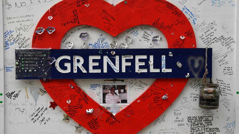 Messages of condolence are seen on temporary hoardings near the Grenfell Tower, after it was announced Britain&#39;s government will seek an extra 4 billion pounds ($5.4 billion) from property developers to fund repairs to dangerous apartment blocks, in the wake of a fire that killed more than 70 people at Grenfell in 2017, in London, Britain, January 10, 2022. REUTERS/Toby Melville

