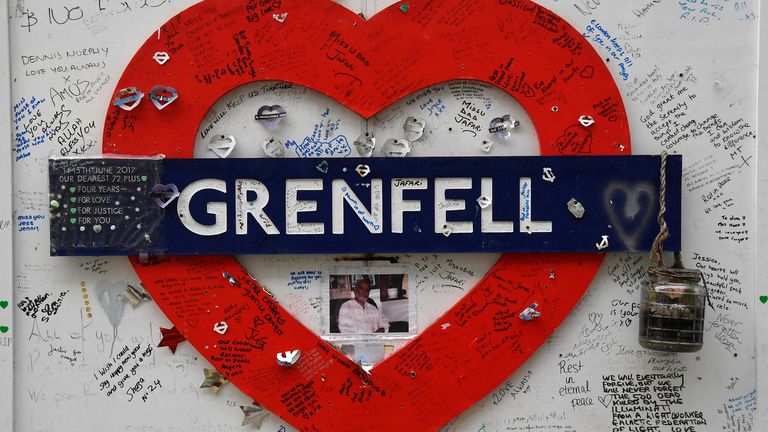 Messages of condolence are seen on temporary hoardings near the Grenfell Tower, after it was announced Britain&#39;s government will seek an extra 4 billion pounds ($5.4 billion) from property developers to fund repairs to dangerous apartment blocks, in the wake of a fire that killed more than 70 people at Grenfell in 2017, in London, Britain, January 10, 2022. REUTERS/Toby Melville
