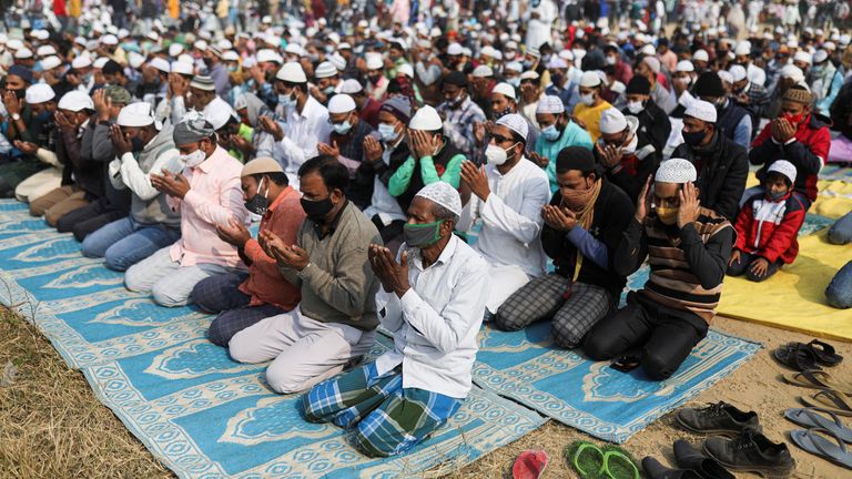 Indian Muslims offer Friday prayers in an open ground after local media reported that several prayer sites were closed by the Gurugram district administration following demands by right wing Hindu groups to ban prayers in open spaces, in Gurugram, India, December 24, 2021. REUTERS/Anushree Fadnavis
