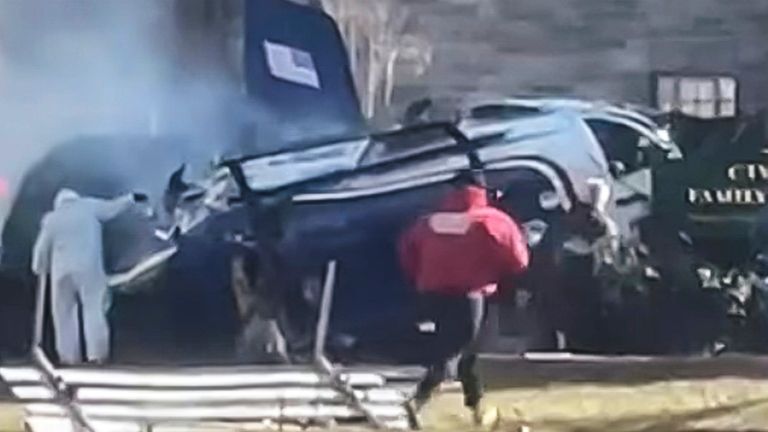 Still image from mobile phone footage of aftermath of helicopter crash. Pic: AP