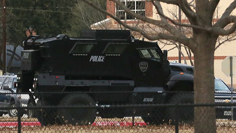 Hostage incident at Texas synagogue
A law enforcement vehicle is parked at a school in the area where a man believed to have taken people hostage at a synagogue during services that were being streamed live, in Colleyville, Texas, U.S. January 15, 2022. REUTERS/Shelby Tauber