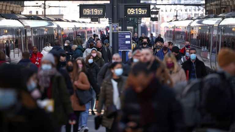 People walk along a platform at King&#39;s Cross train station, amid the ongoing coronavirus disease (COVID-19) outbreak in London, Britain, January 21, 2022. REUTERS/Henry Nicholls
