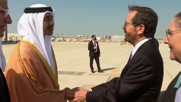 Israel&#39;s president Isaac Herzog shakes the hand of the UAE leader in Abu Dhabi, Sheikh Abudallah bin Zayed Al Nahyan
