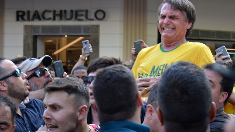 Brazilian presidential candidate Jair Bolsonaro reacts after being stabbed during a demonstration in Juiz de Fora, state of Minas Gerais, Brazil on September 6, 2018.