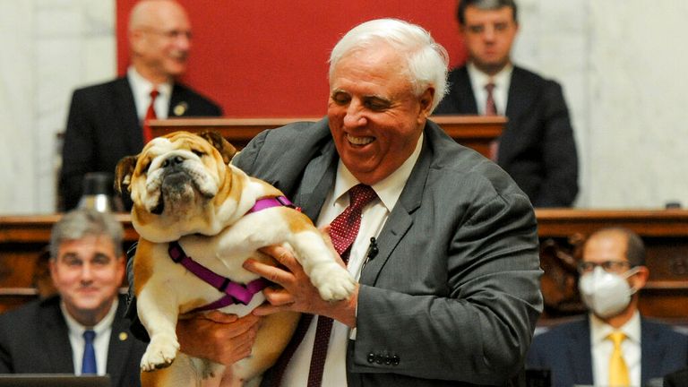 Bette Midler: West Virginia governor Jim Justice raises dog’s backside in the air and tells actress to ‘kiss her hiney!’