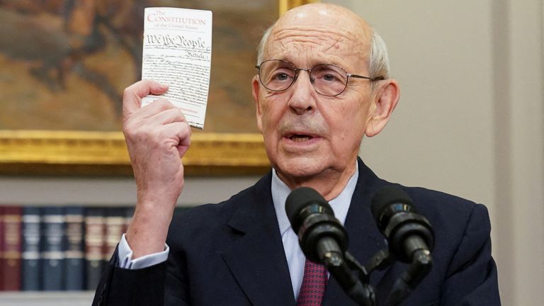 U.S. Supreme Court Justice Stephen Breyer holds up a copy of the U.S. Constitution as he announces he will retire at the end of the court&#39;s current term, at the White House in Washington, U.S., January 27, 2022. REUTERS/Kevin Lamarque TPX IMAGES OF THE DAY
