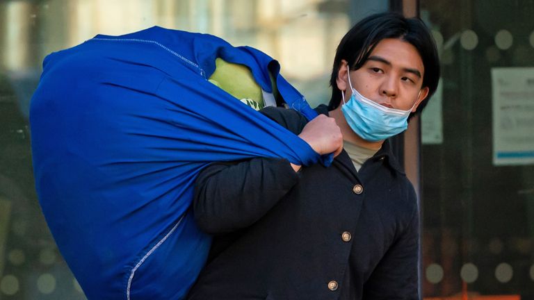 Joseph Huang Kang, 24, outside Westminster Magistrates' Court, central London, where he is charged with trespassing in the Royal Mews. Mr Kang, who is accused of sneaking into the stables of Buckingham Palace on December 10, 2021, was bailed on condition that he not be within 200 metres of Buckingham Palace and that he does not attempt to leave the United Kingdom. Picture date: Wednesday January 12, 2022.  