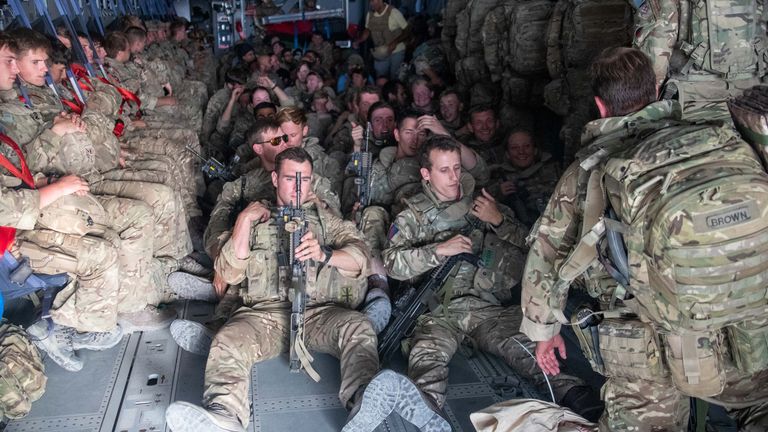 UK military personnel onboard a A400M aircraft departing Kabul