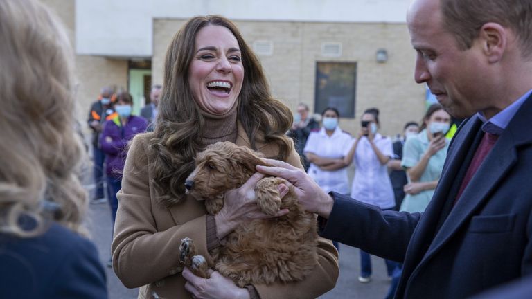The Duchess of Cambridge become acquainted with Alfie the &#39;therapy puppy&#39; on a visit to a hospital in Lancashire
