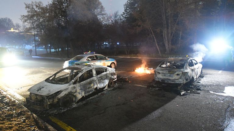 Damaged cars are seen near the mayor&#39;s office during protests triggered by fuel price increase in Almaty, Kazakhstan January 5, 2022. REUTERS/Stringer
