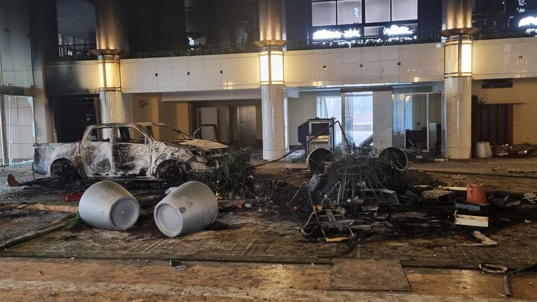 A burned car is seen inside the Presidential Residence which was stormed by demonstrators during the protests triggered by fuel price increase in Almaty, Kazakhstan January 6, 2022. REUTERS/Pavel Mikheyev
