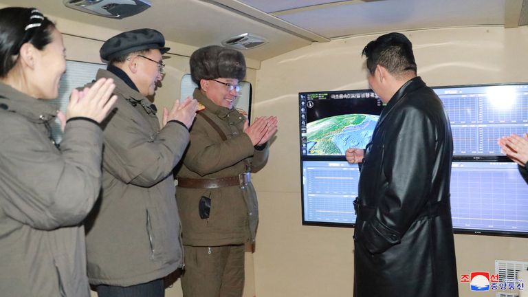Kim Jong Un talks to officials