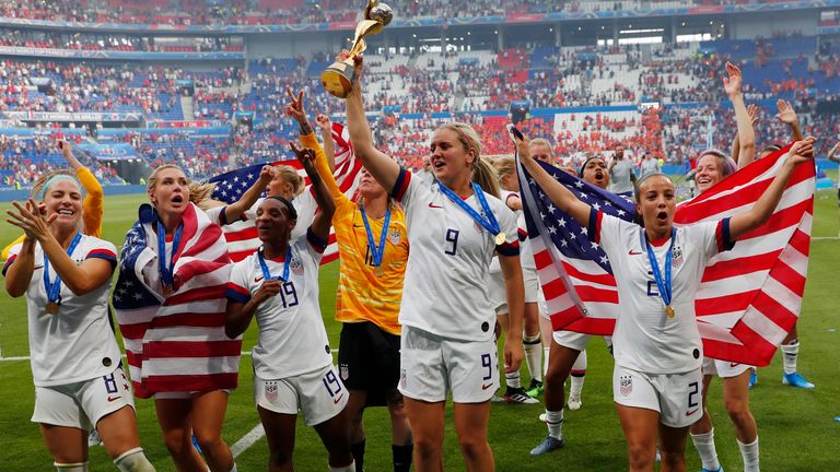 US midfielder Lindsey Horan hoists the World Cup trophy following the 2019 final