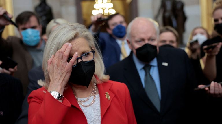 U.S. Rep. Liz Cheney (R-WY) and her father, former Vice President Dick Cheney, are pursued by reporters after attending a moment of silence event to mark the first anniversary of the January 6, 2021 attack on the U.S. Capitol by supporters of former President Donald Trump, on Capitol Hill in Washington, U.S., January 6, 2022. REUTERS/Evelyn Hockstein TPX IMAGES OF THE DAY
