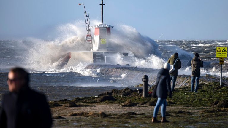 The powerful storm has caused waves to smash into the harbour in Malmo, Sweden. Pic: AP