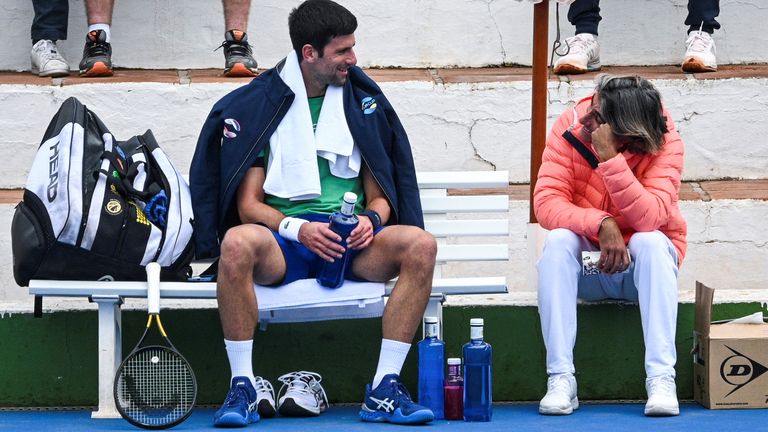 Serbian tennis player Novak Djokovic talks to his assistant Pepe Imaz during a training session at Puente Romano Tennis Club in Marbella, Spain, January 3, 2022. Picture taken January 3, 2022. KMJ-GTRES/Handout via REUTERS THIS IMAGE HAS BEEN SUPPLIED BY A THIRD PARTY.

